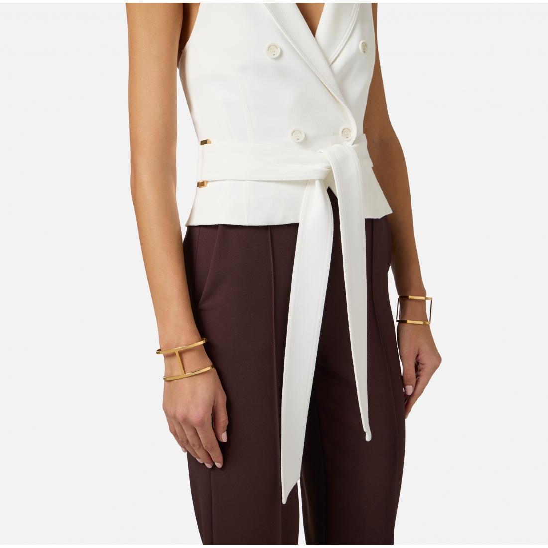 Coppia di bracciali in metallo dorato