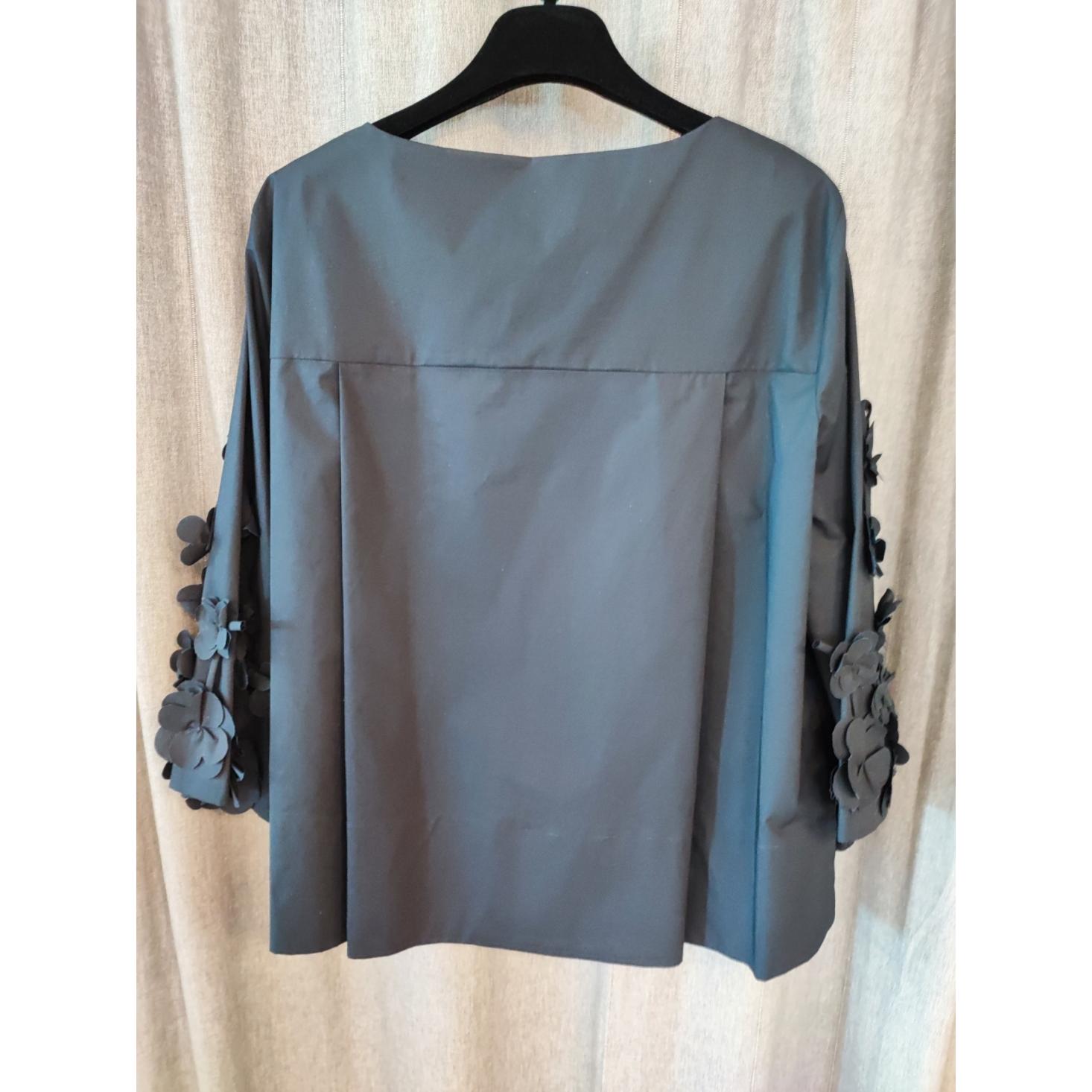 BLUSA CON APPLICAZIONI FLOREALI
