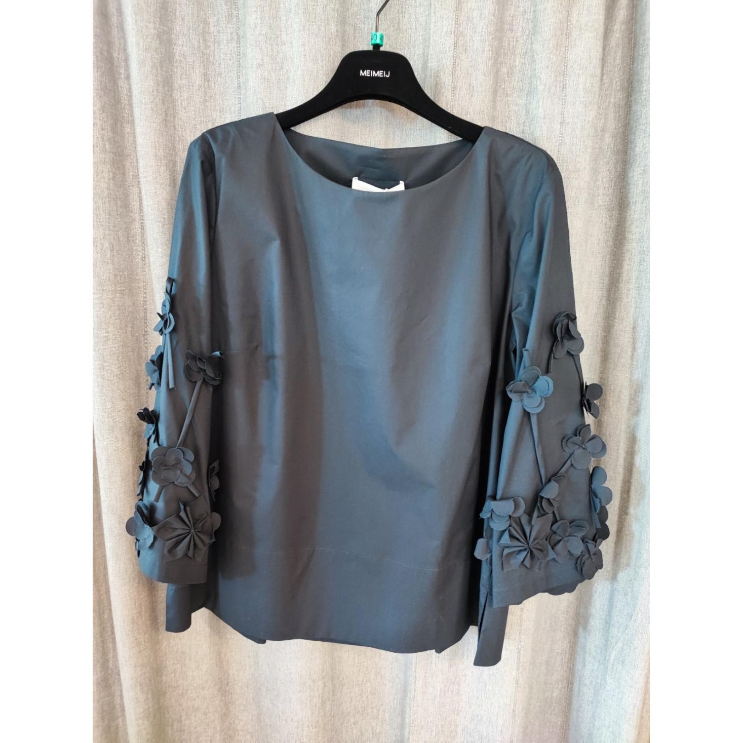 BLUSA CON APPLICAZIONI FLOREALI