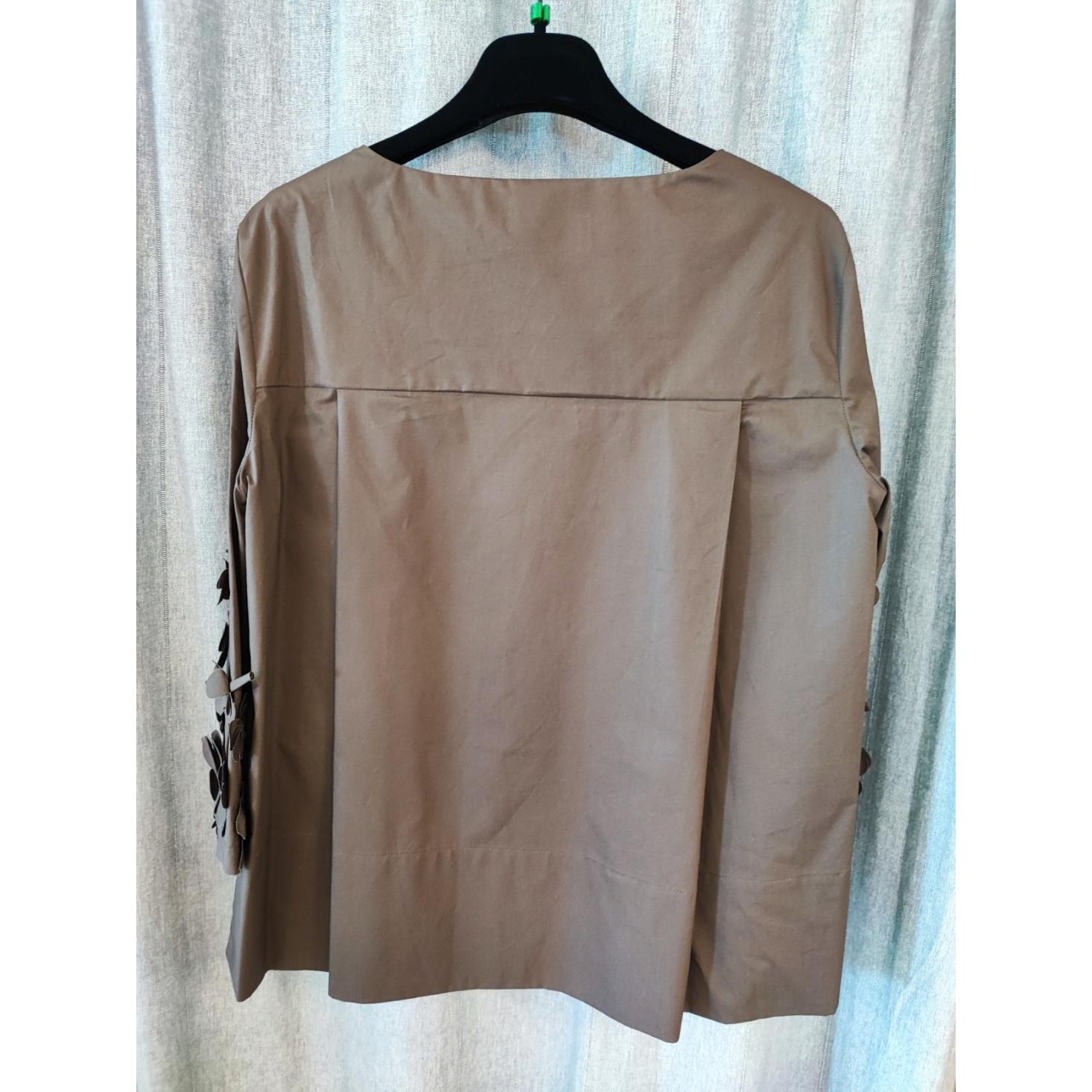 BLUSA CON APPLICAZIONI FLOREALI