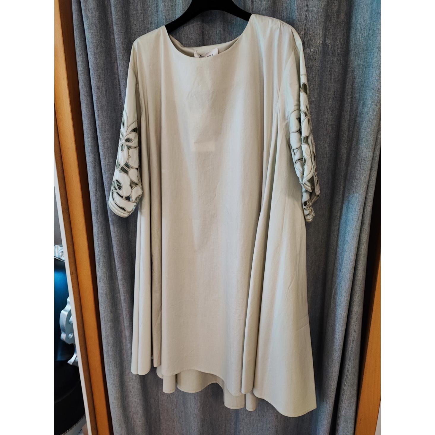 ABITO OVERSIZE CON MAICHE RICAMATE