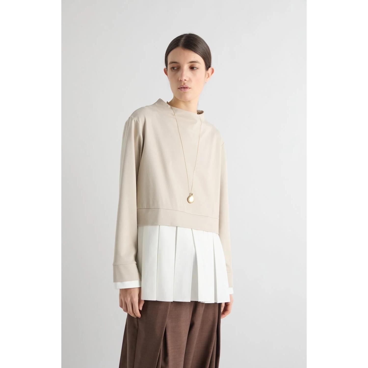 BLUSA CON BALZA PLISSETTATA